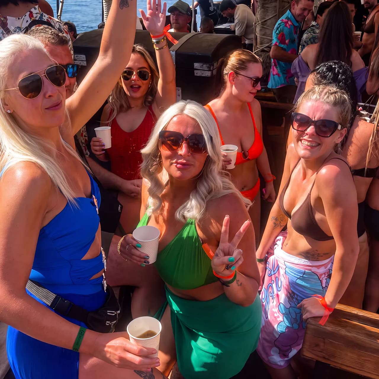 Guests enjoying drinks together on the boat deck